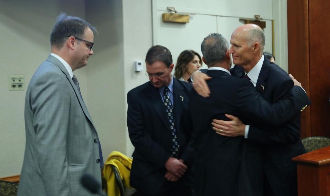 Gov. Rick Scott hugs Andrew Pollack, whose daughter Meadow Pollack was killed in the Marjory Stoneman Douglas High School shooting in Parkland. On the far left is Ryan Petty, whose daughter Alaina Petty was also killed. Scott greeted the Parkland parents during a Florida Cabinet meeting at the Capitol.