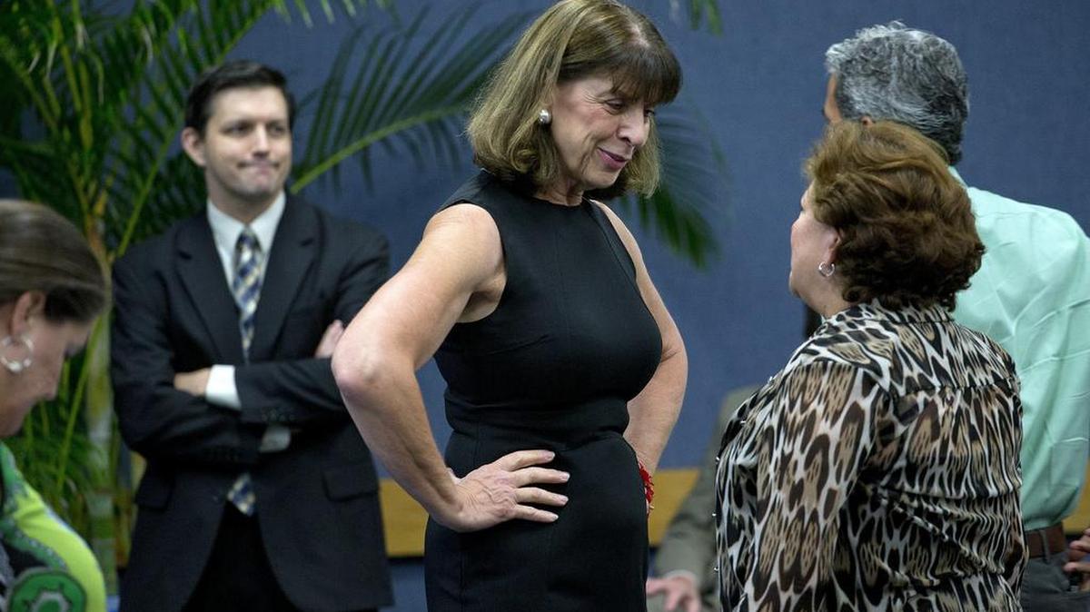 Elizabeth Dudek (center), secretary of Florida’s Agency for Health Care Administration, chats before a meeting of the Commission on Healthcare and Hospital Funding at Miami Dade College’s Medical Campus on Thursday, July 23, 2015.