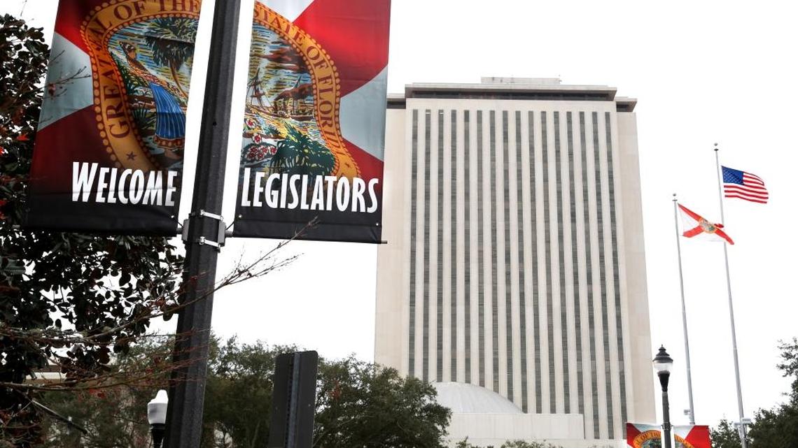 Banners greeting Florida lawmakers hang along Adams Street in Tallahassee outside of Florida’s Capitol. The 60-day annual legislative session begins Tuesday.