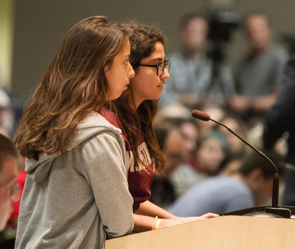 Marjory Stoneman Douglas High School students Bela Urbina, left, and Katherine Guerra, both 15-year-old sophomores, speak to the Senate Rules Committee meeting on gun safety Monday.