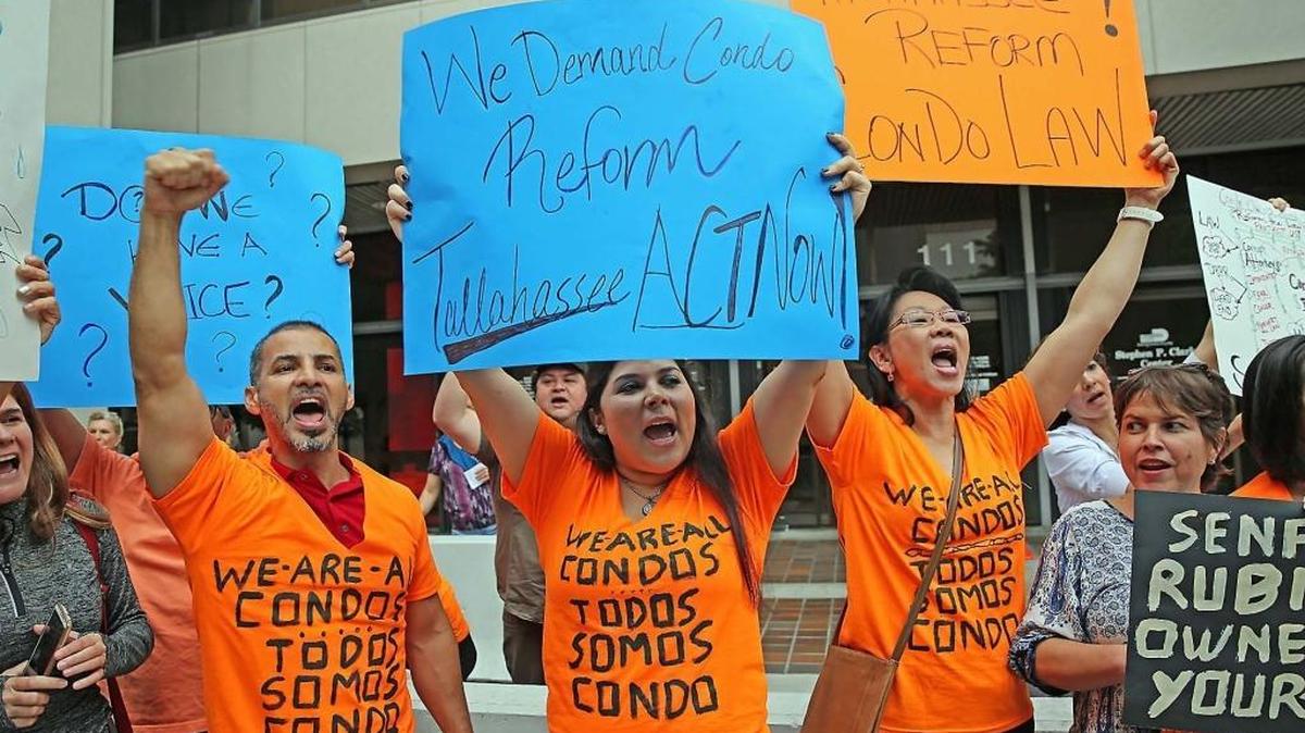 Condo owners protest outside the government center in downtown Miami in support of condo law reform on Wednesday, February 22, 2017.