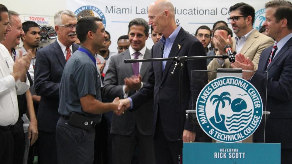 
Florida Gov. Rick Scott on Monday shakes Deinier Garcia’s hand after giving him the Governor’s Excellence in Technical Education Award at Miami Lakes Educational Center. As a student at Miami Lakes, Garcia started the T-Ten program at the school. 
