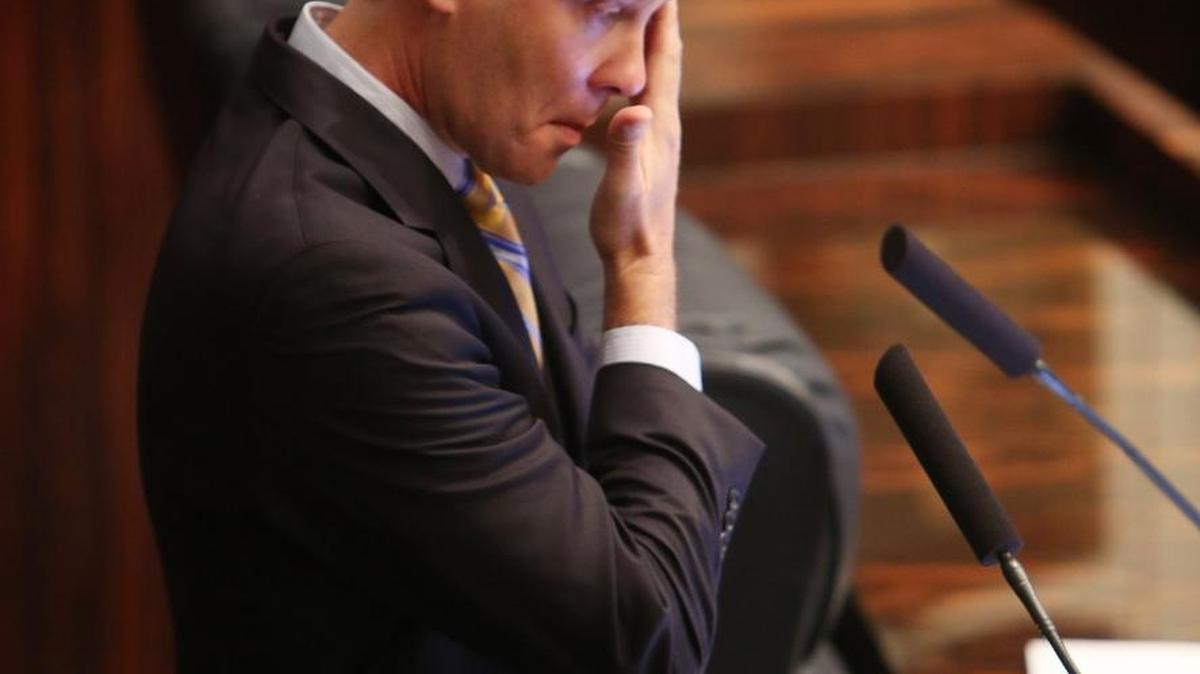 Senate President Andy Gardiner, R-Orlando, wipes away tears as the bill for families with children with special needs passes during session, Wednesday, Jan. 13, in Tallahassee.