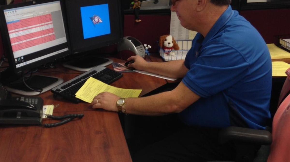 
Martin Munro of the Pinellas County Supervisor of Elections office verifies petitions in support of a 2016 ballot initiative to legalize medical use of marijuana.
