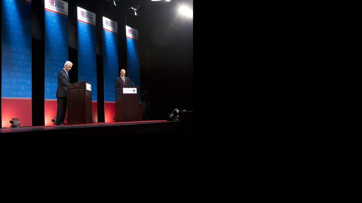
Florida Republican Gov. Rick Scott, right, and his Democratic challenger Charlie Crist, hold their second debate, Wednesday, Oct. 15, 2014 in Davie. It is sponsored by the Florida Press Association and Leadership Florida. 
