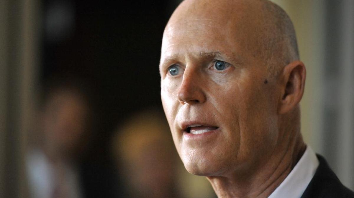Florida Gov. Rick Scott speaks with the media, Tuesday in Jacksonville after a brief meeting with citizens who felt they were overcharged by hospitals for medical care.