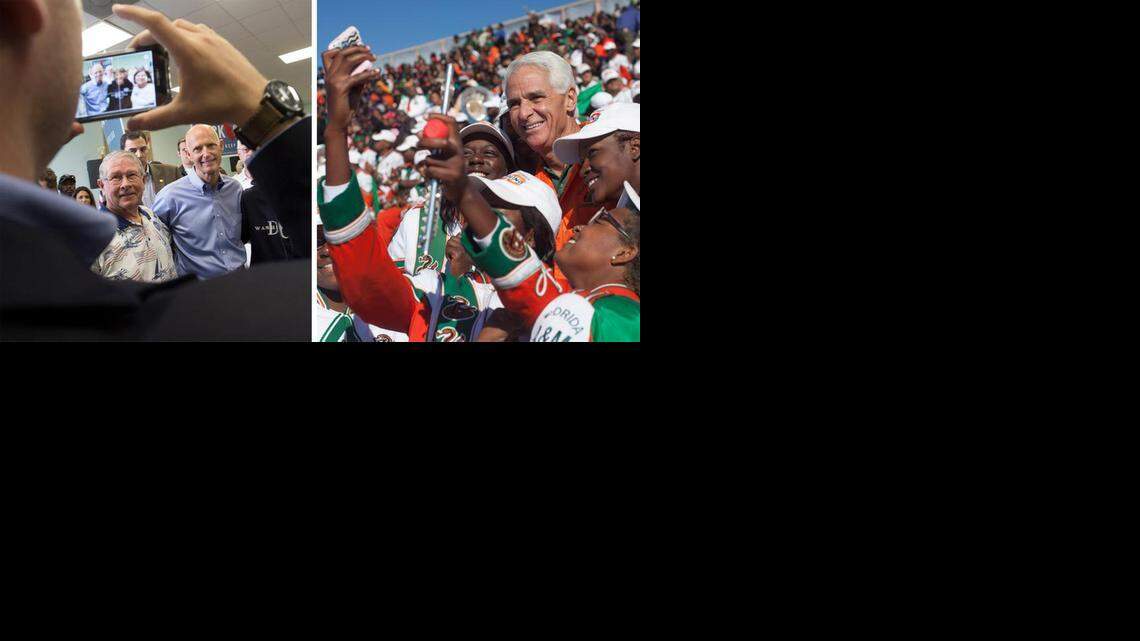 
Gov. Rick Scott, left, and Charlie Crist, right, campaign Saturday, Nov. 1, 2014. 
