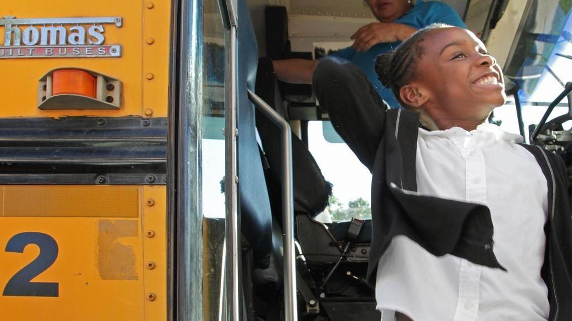 Dance students joyfully exit the school bus upon arrival at Miami City Ballet, October 1, 2015. Starting in the 2017-18 school year, parents will be able to send students to any public school that has space. Miami City Ballet participates in a scholarship program for disadvantaged kids who arrive by bus after school, attend ballet school for free, get a snack and do their homework.
