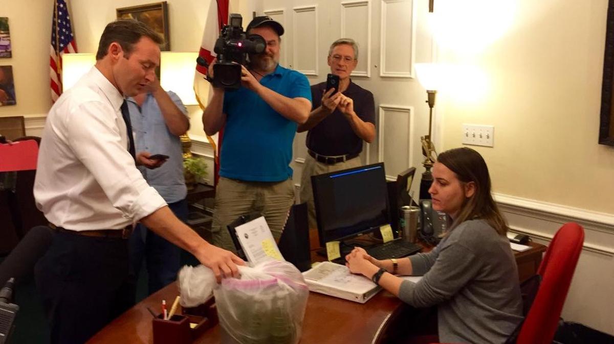 Democratic U.S. Senate candidate Democratic U.S. Senate candidate Patrick Murphy, a Jupiter congressman, hand-delivered several bottles full of toxic algae water to Republican Gov. Rick Scott’s Tallahassee office on Tuesday.