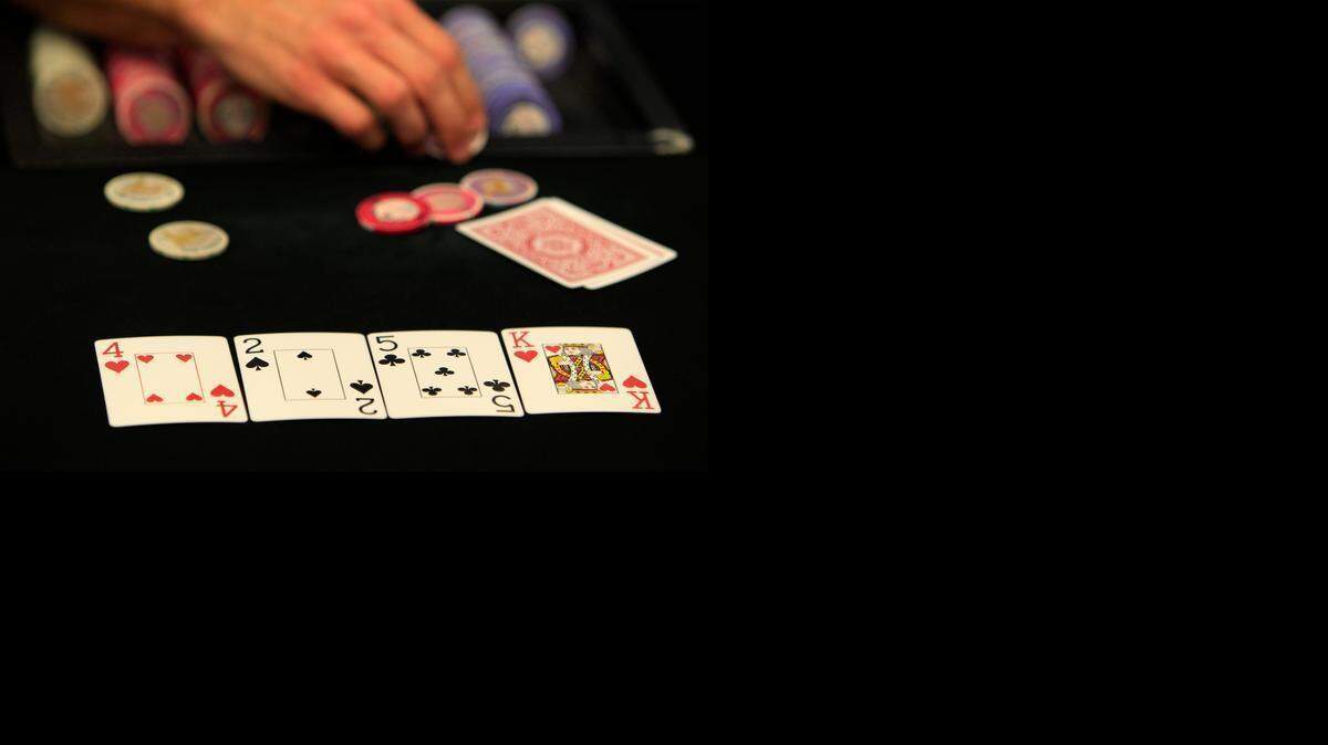 
In this Nov. 9, 2011, file photo, a poker dealer is works a game at the Magic City Casino in Miami. 

