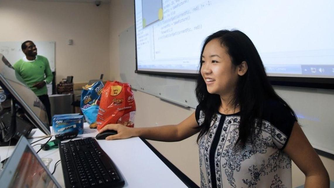 Jacqueline Nguyen, 16, grins after successfully solving a coding sequence during an intensive computer skills summer immersion program for girls, presented by Florida International University’s School of Computing and Information Sciences and Girls Who Code.