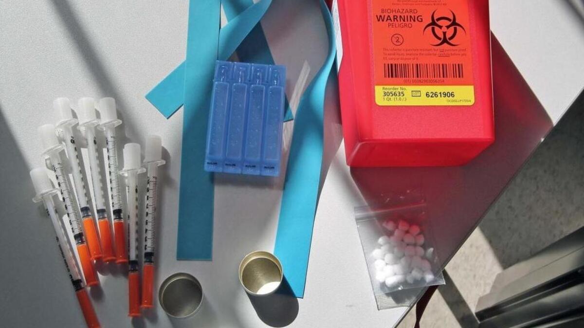 The University of Miami’s needle exchange care package includes needles, water, boiling caps, cotton, rubber band and a disposal container.