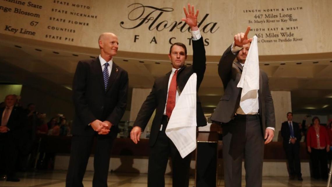 Florida Gov. Rick Scott watches as House Sergeant-at-Arms Russell Hosford and Senate Sergeant-at Arms Timothy Hay drop handkerchiefs during the ‘Sine Die’ ceremony to end the 2016 Florida legislative session Friday in Tallahassee.