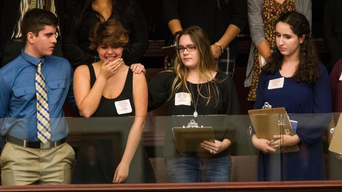 Sheryl Acquarola, a 16-year-old junior from Marjory Stoneman Douglas High School in Parkland, is overcome with emotion in the east gallery of the state House of Representatives after the representatives voted not to hear a bill banning assault rifles and large-capacity magazines at the Capitol in Tallahassee on Tuesday, Feb. 20, 2018.