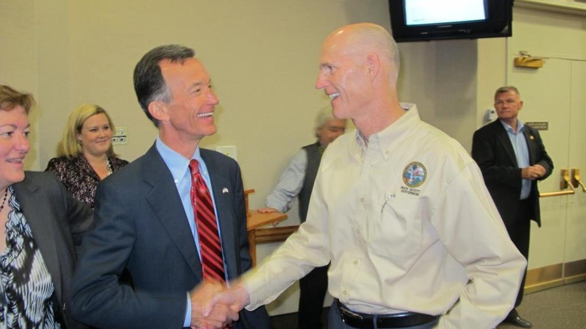 Gov. Rick Scott, right, greets Tom Grady during the Aug. 2, 2011 Cabinet meeting in which Grady was appointed head of Financial Regulation.