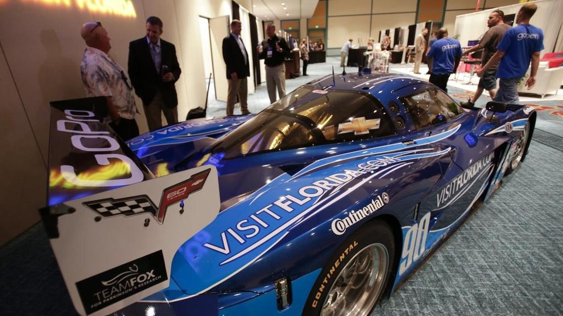 A Corvette race car sponsored by VisitFlorida.com is on display at the Governor’s Conference on Tourism trade show, Wednesday, Sept. 11, 2013, in Orlando. Visit Florida’s sponsorship of the racing team, a soccer team and $1 million contract with Pitbull drew scrutiny from the legislature.