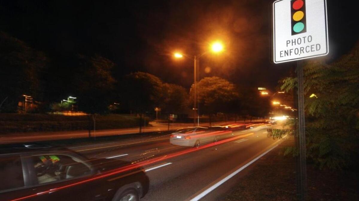 Red-light cameras are in action at U.S. 1 and SW 22nd Avenue, July 20, 2011.