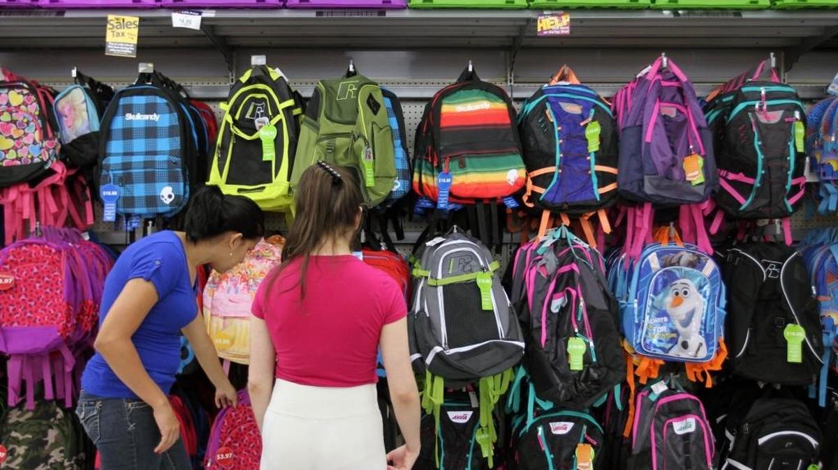 Customers choose merchandise at the Doral Walmart’s back to school sale during the tax-free holiday on Tuesday, August 4, 2015. The Florida House proposes a 10-day sales tax holiday that would save consumers a few dollars on purchases of items under $100 but cost the state $56 million in lost revenue.