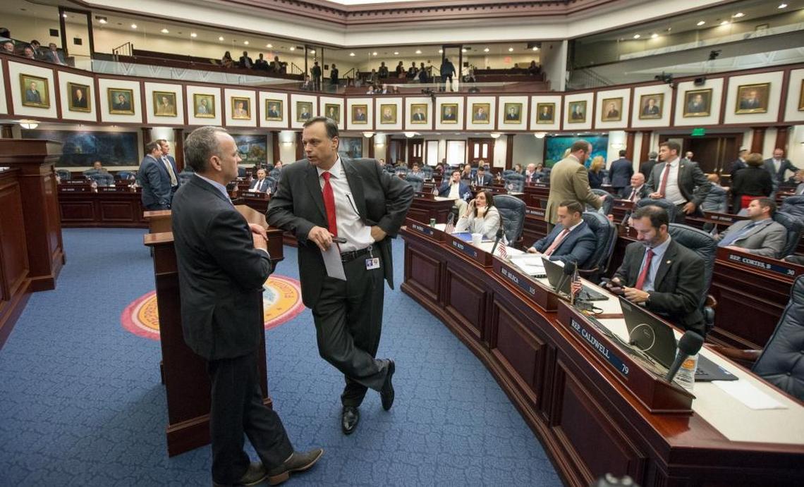 Sen. Tom Lee, right, R-Thonotosassa, talks with Speaker of the House Richard Corcoran, R-Land O’Lakes, on the House floor during late negotiations Friday May 5, 2017 at the Florida Capitol in Tallahassee.