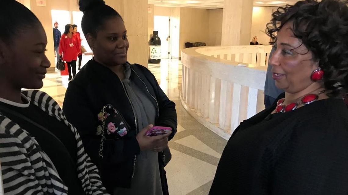 Sherry Johnson talks with her daughter Tolonda Tolbert, 42, and granddaughter Danielle Wiggins, 16, after legislation that would ban marriage under the age of 18 passed the Senate unanimously Wednesday.