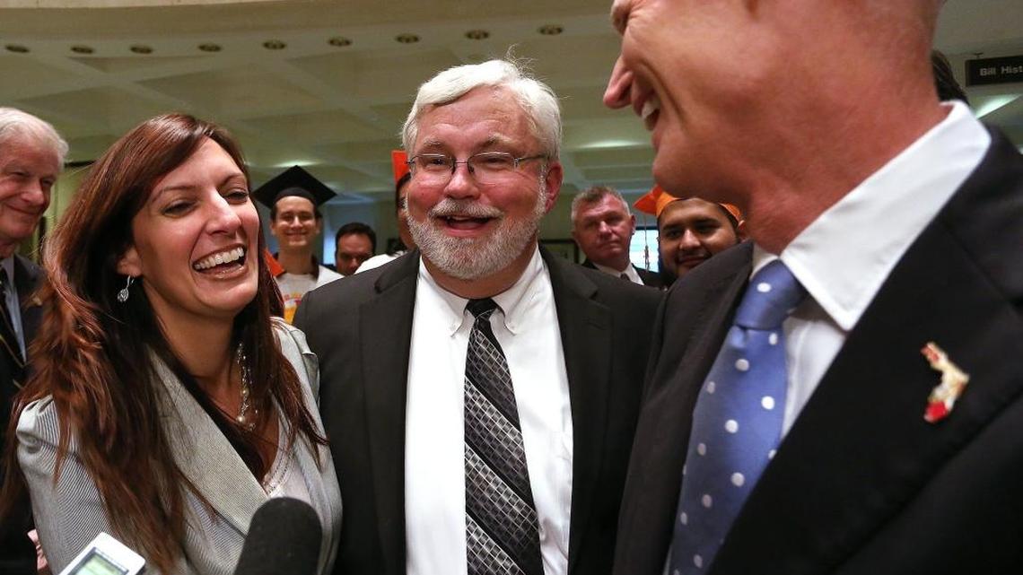 From left, Rep. Jeanette M. Nunez, R-Miami, Sen. Jack Latvala, R-Clearwater, and Gov. Rick Scott, react, Thursday, May 1, 2014, to the passage of an immigrant tuition bill.