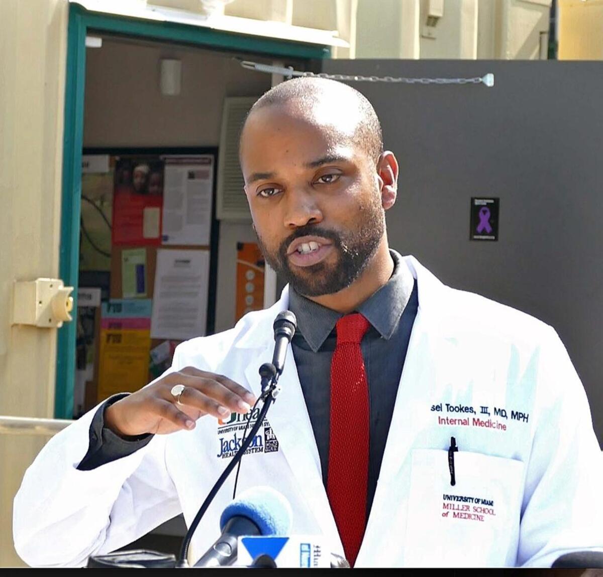 Dr. Hansel Tookes speaks during a news conference at the IDEA Exchange on April 27, 2017, where he announced that the University of Miami Idea Exchange will begin distributing naloxone, or Narcan, at a needle exchange program in Overtown, the center of Miami’s opioid epidemic.