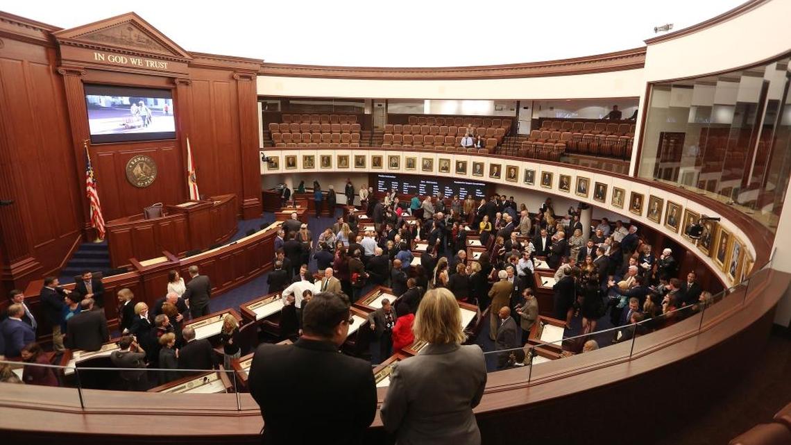 Visitors, Florida senators and their staff members look at the new Florida Senate chamber on Monday, Nov. 21, 2016. The $6 million renovation took eight months to complete.