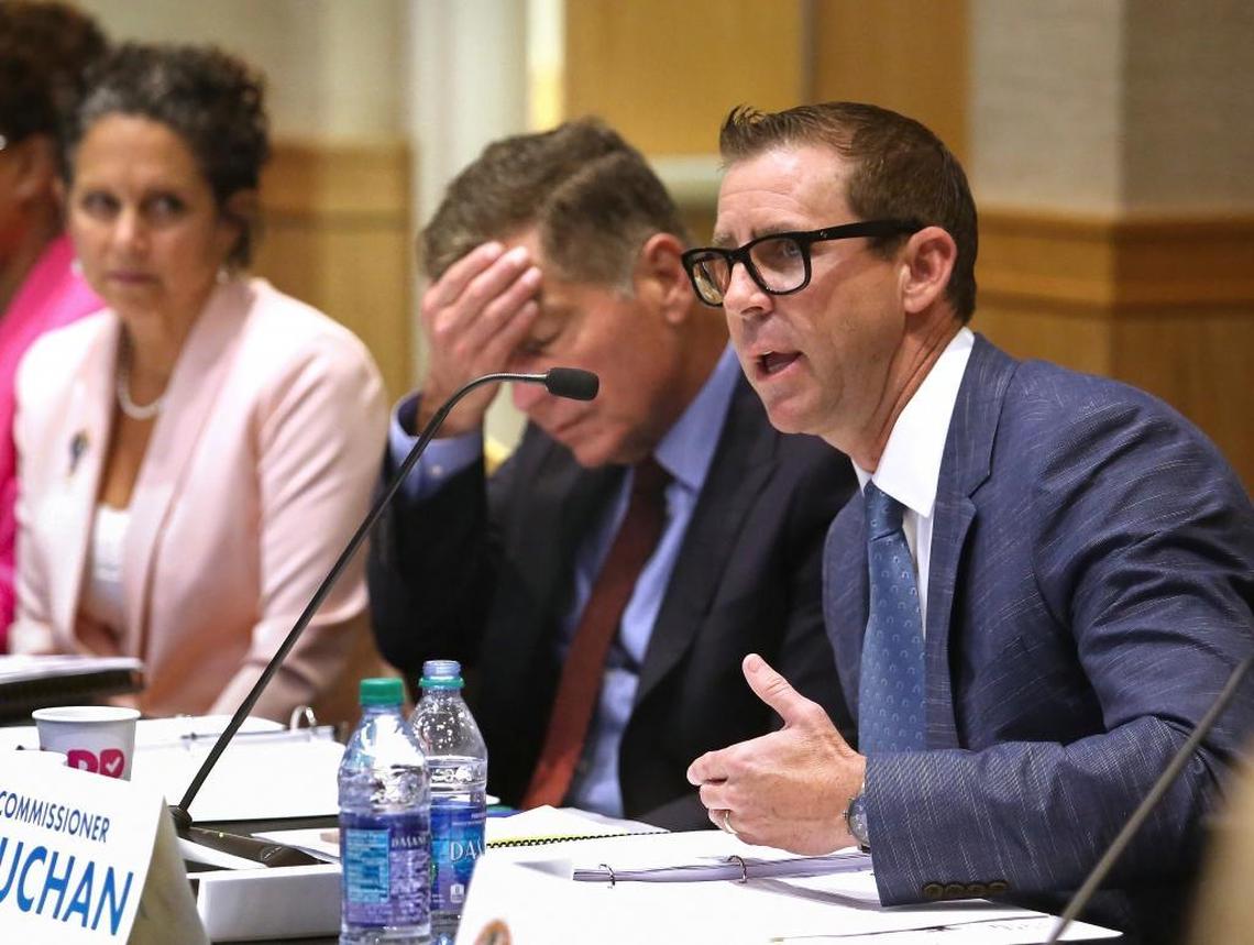 In this June 6, 2017, file photo, Florida Constitution Revision Commissioner Brecht Heuchan, right, raises a question about how commissioners are appointed during their meeting at the University of Central Florida in Orlando. Listening are commissioners Jacqui Thurlow-Lippisch, left, and Dr. Pepe Armas.