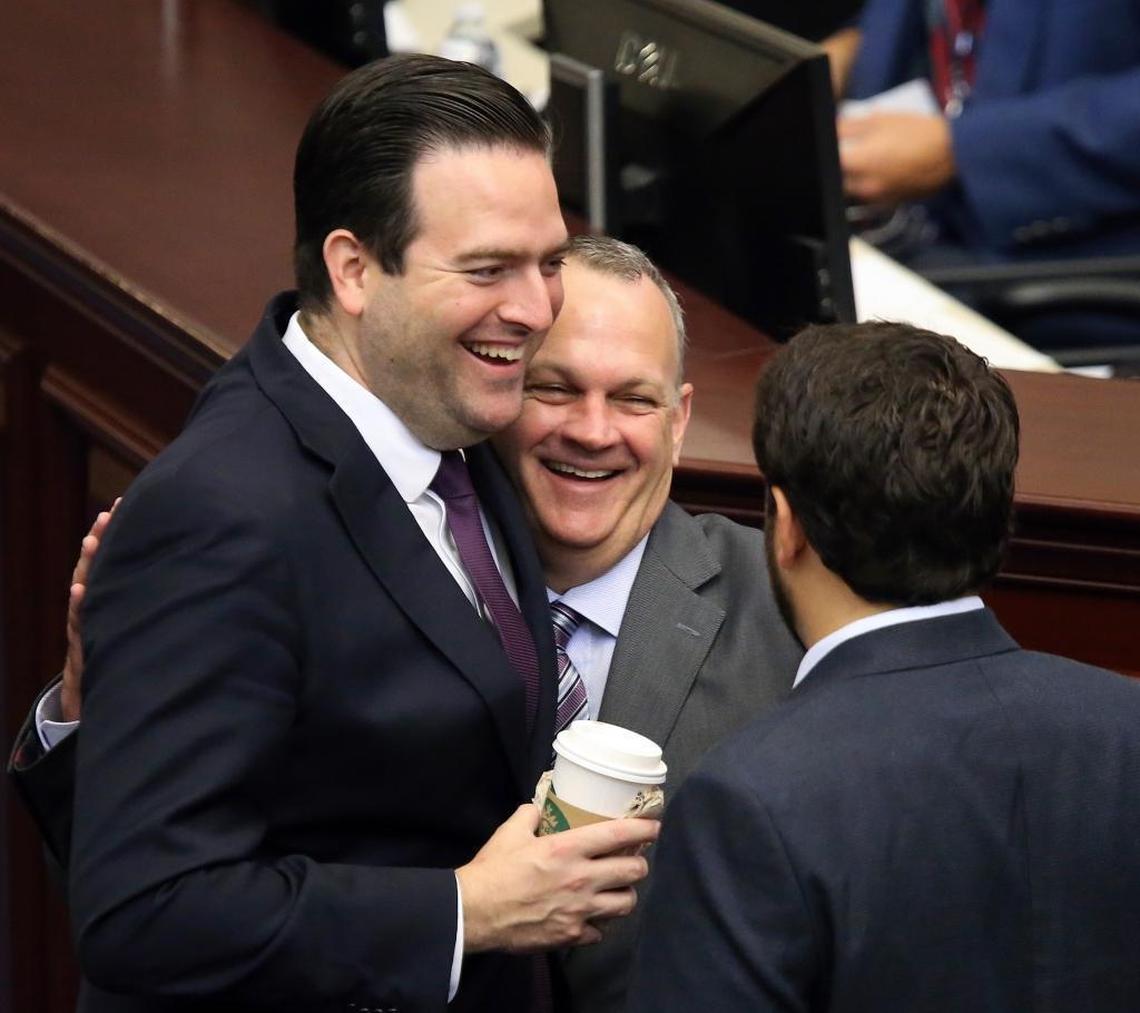 Rep. Jose Diaz, R-Miami, left, and Rep. Manny Diaz, R-Hialeah, share a moment with House Speaker Richard Corcoran, R-Land O’Lakes, center, before the start of session, Friday, June 9, 2017, in Tallahassee.