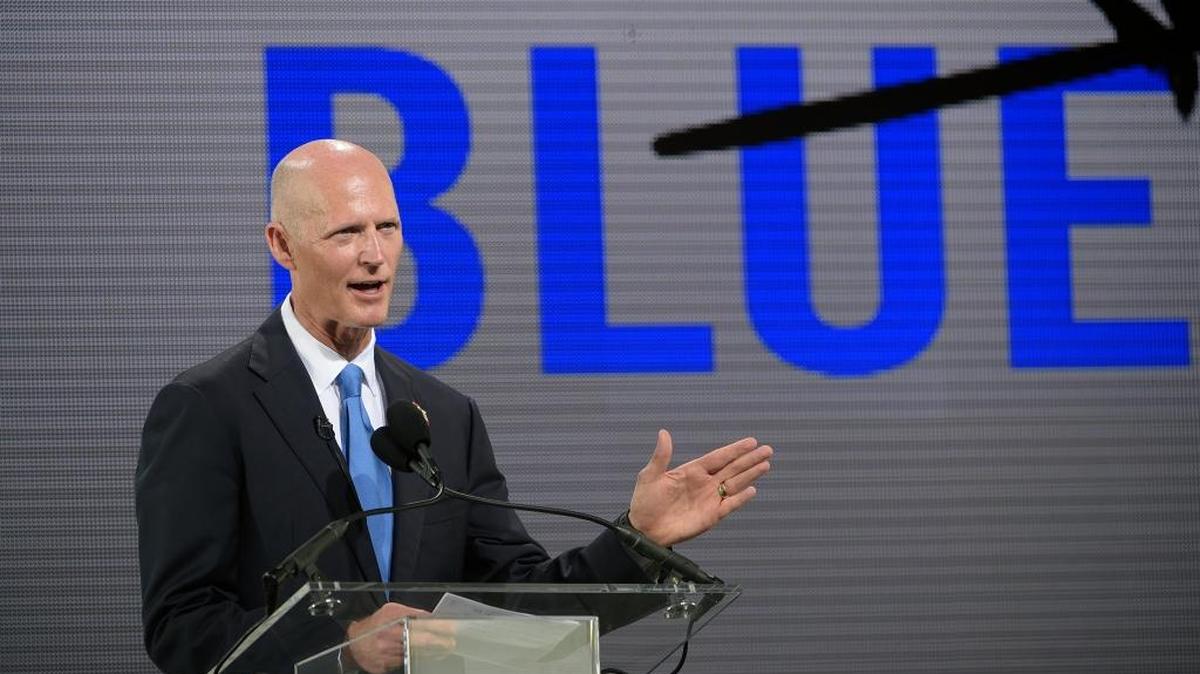
Gov. Rick Scott addresses reporters and guests during a news conference unveiling the new Blue Origin rocket at the Cape Canaveral Air Force Station, Sept. 15, 2015. Amazon CEO Jeff Bezos announced a $200 million investment to build the rockets and capsules in the state and launch them using the historic Launch Complex 36. 
