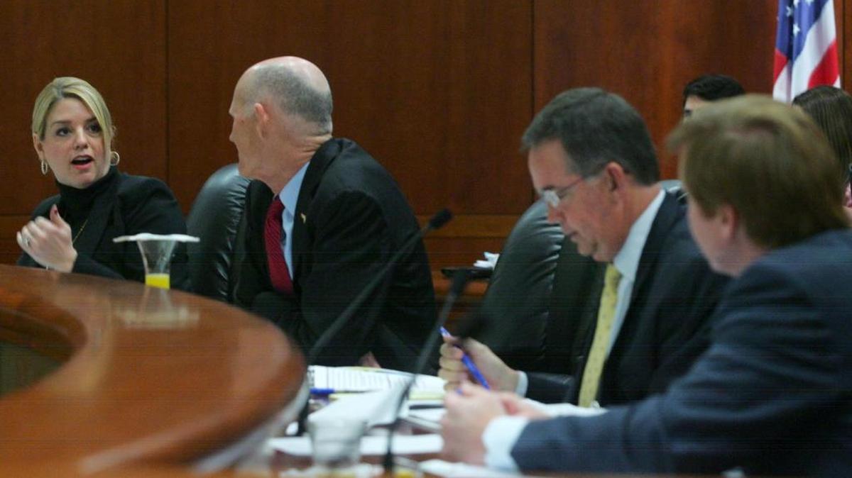 
Regular seating at a Cabinet meeting puts CFO Jeff Atwater between Commissioner of Agriculture Adam Putnam, far right, and Gov. Rick Scott. Attorney General Pam Bondi is at the far left. 

