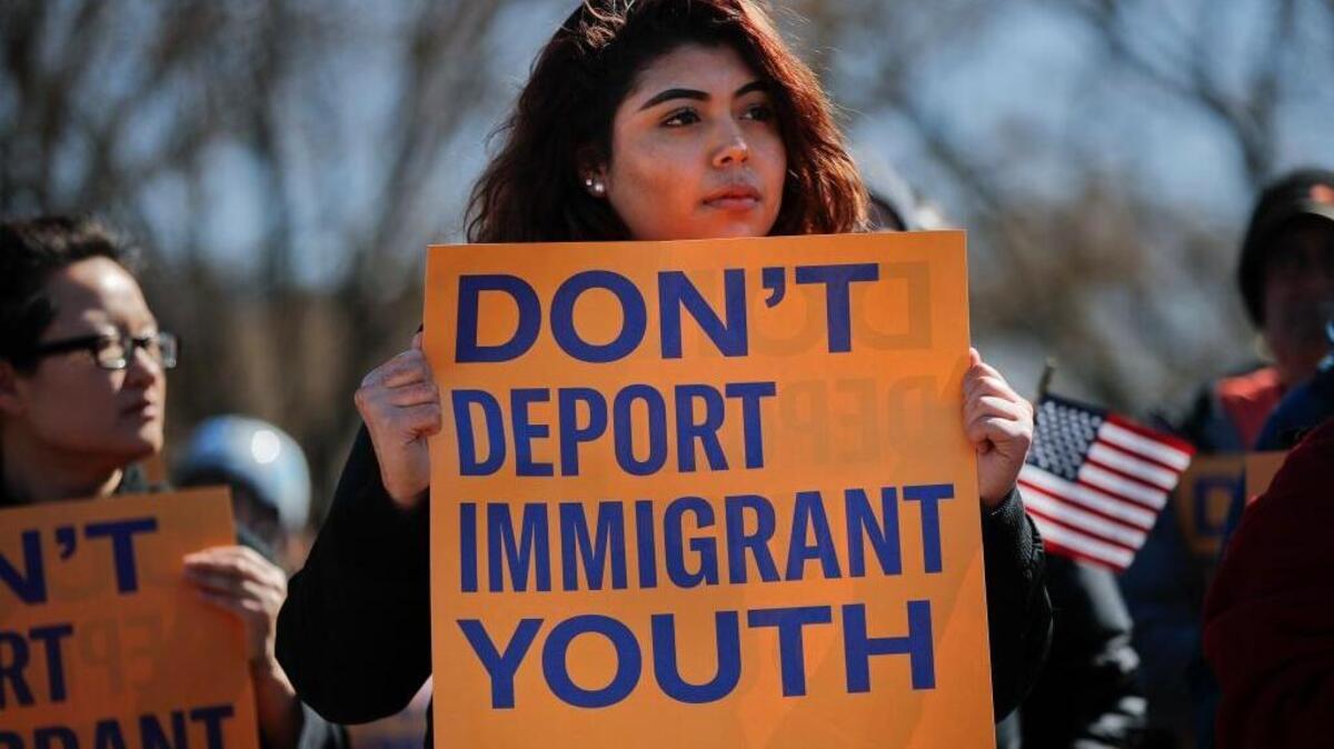 Gabriela Martinez, 19, from Prince George’s County, Maryland, holds a sign as she joins immigration advocates from the American Civil Liberties Union, Union We Dream, MoveOn and others during the announcement of a new campaign targeted at President Trump's immigration policies, in front of the White House in Washington on March 4, 2018.