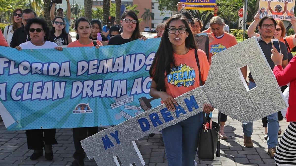 Nery Lopez, a DACA recipient, right, carries the “Dream Key” as she leads supporters of Dreamers — made up of immigrant youth, mothers and community members from United We Dream, We Belong Together, Students Working for Equal Rights (SWER), Florida Immigrant Coalition (FLIC), We Count!, Women Working Together, Friends of Miami-Dade Detainees, and Florida Student Power Network — up to the front doors of Sen. Marco Rubio’s district office on Monday, Jan. 22, 2018, in Doral, Fla. They were denied access due to the government shutdown and Sen. Rubio’s presence in Washington, D.C.