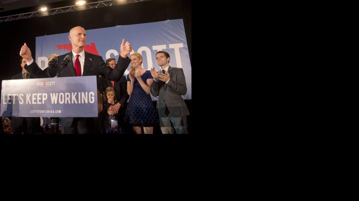 
Florida Gov. Rick Scott gives two thumbs up before making a victory speech after defeating Democratic challenger, former Gov. Charlie Crist on Tuesday, Nov. 4, 2014 in Bonita Springs, Fla. 
