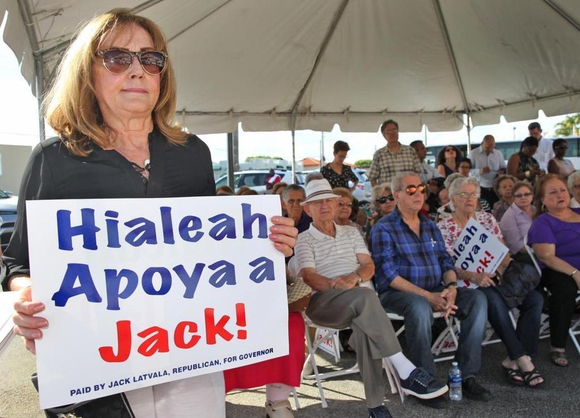 Hialeah voter Berta Marinez holds a sign supporting candidate Jack Latvala who is running for governor for the State of Florida, kicking off his campaign in Hialeah on Wednesday, August 16, 2017.
