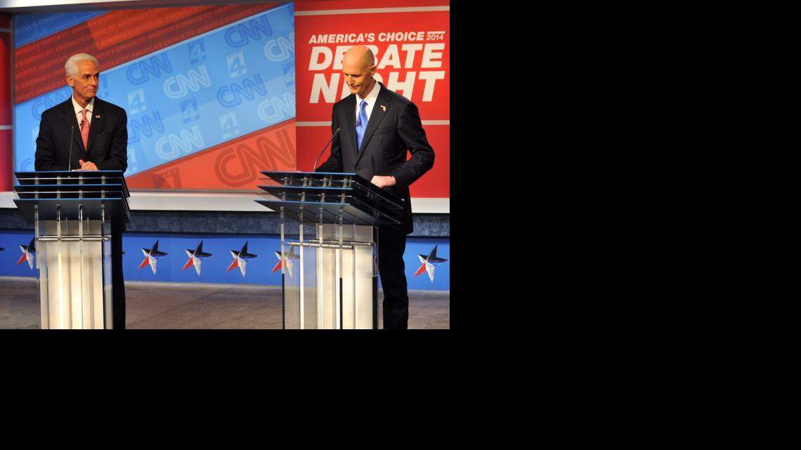 
Democratic candidate Charlie Crist, left, and Republican Gov. Rick Scott wait for their live televised debate, Tuesday, Oct. 21, 2014 hosted by WJXT-TV and CNN at the Channel 4 studios in Jacksonville.
