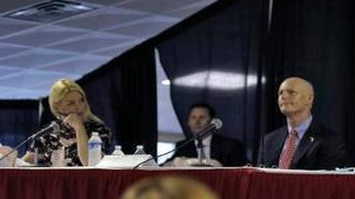 
Members of the Florida Cabinet, from left, Attorney General Pam Bondi, Gov. Rick Scott, Chief Financial Officer Jeff Atwater, and Agriculture Commissioner Adam Putnam, meet at the Florida State Fair Thursday, Feb. 5, 2015, in Tampa, Fla. Scott is saying he mishandled the ouster of the head of Florida's main law enforcement agency. Scott made the statement at the start of Thursday's meeting of the governor and Cabinet. He did not explain what exactly he could have done differently. Questions have been raised about Scott's decision to force out Gerald Bailey, the former commissioner of the Florida Department of Law Enforcement. Bailey said he was pushed out after resisting potentially unethical requests from the Scott administration and his re-election campaign. 


