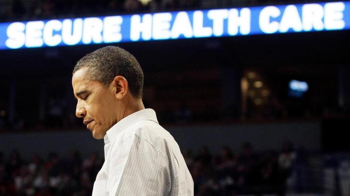 President Barack Obama pauses during a health insurance reform rally, Saturday, Sept. 12, 2009, in Minneapolis.