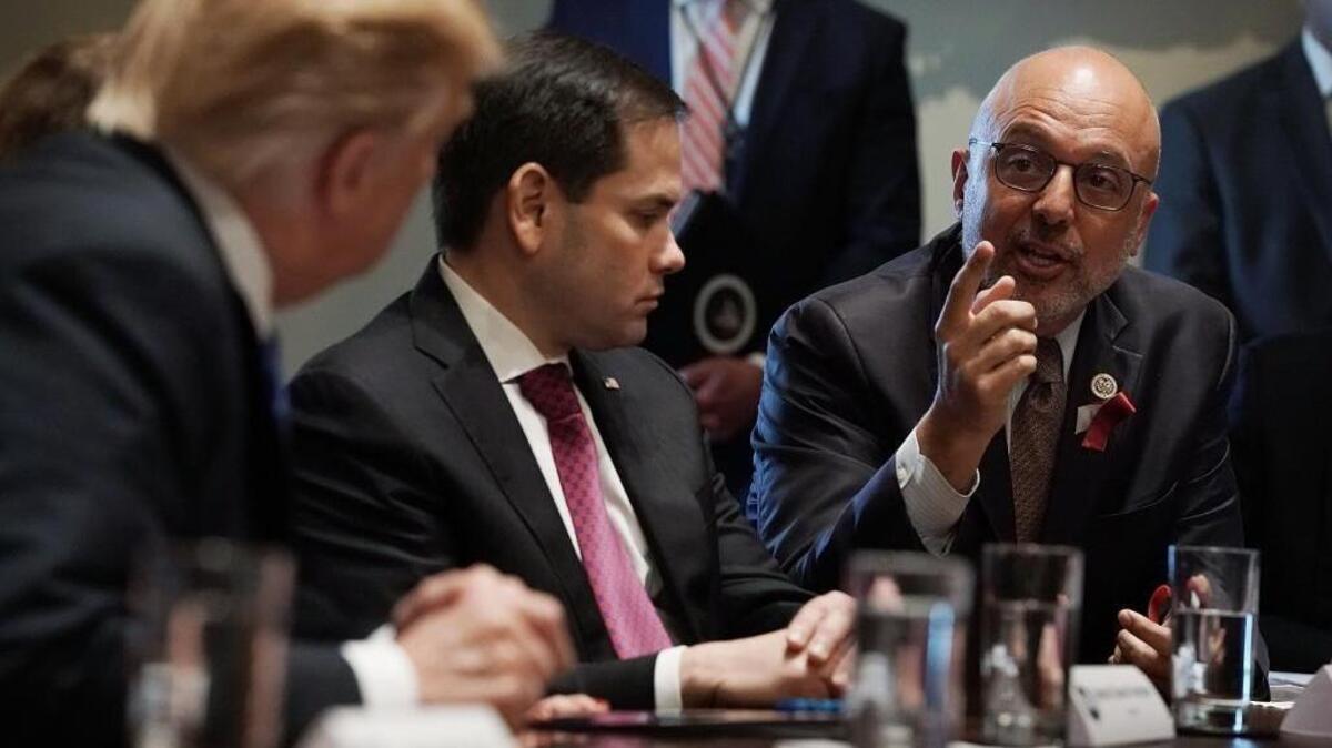 U.S. Rep. Ted Deutch speaks as Sen. Marco Rubio and President Donald Trump listen during a meeting with bipartisan members of Congress in the Cabinet Room of the White House on Feb. 28, 2018, in Washington, D.C.