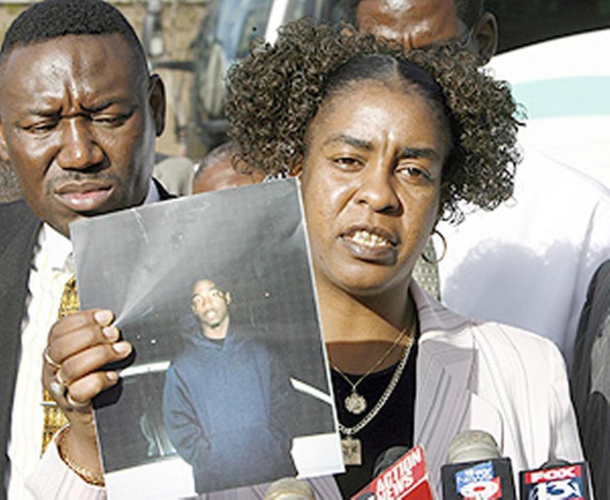 Gina Jones holds a photo of her son Martin Lee Anderson taken just before he entered a Panhandle boot camp. In 2006, he stopped breathing during a restraint at the camp while a nurse stood by and declined to help.