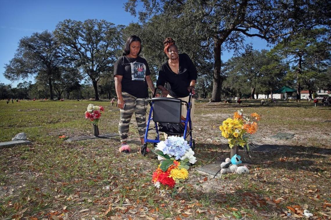 Andre Sheffield’s sister, Tamika, and grandmother and legal guardian, Berlena Sheffield, visit his gravesite at Restlawn Memorial Park in Jacksonville.