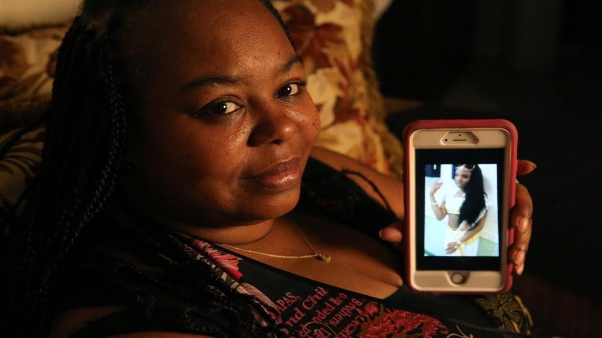 Tara Bostick holds a photo of her transgender child. The child was at the old Thompson Academy in Broward, and sued Youth Services International along with others. Her allegation was that a guard there took her to a public bathroom at a dental office and forced her to perform oral sex. The suit has been settled.