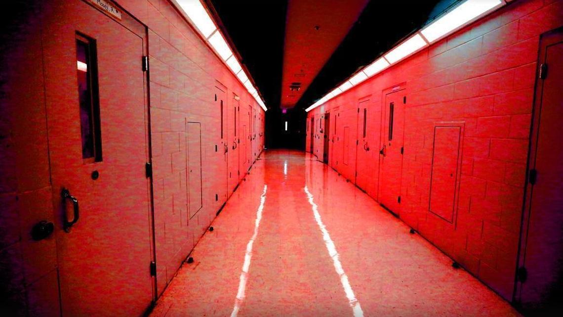 In this photo illustration, a hallway of cells is shown at the Palm Beach Youth Academy in West Palm Beach.