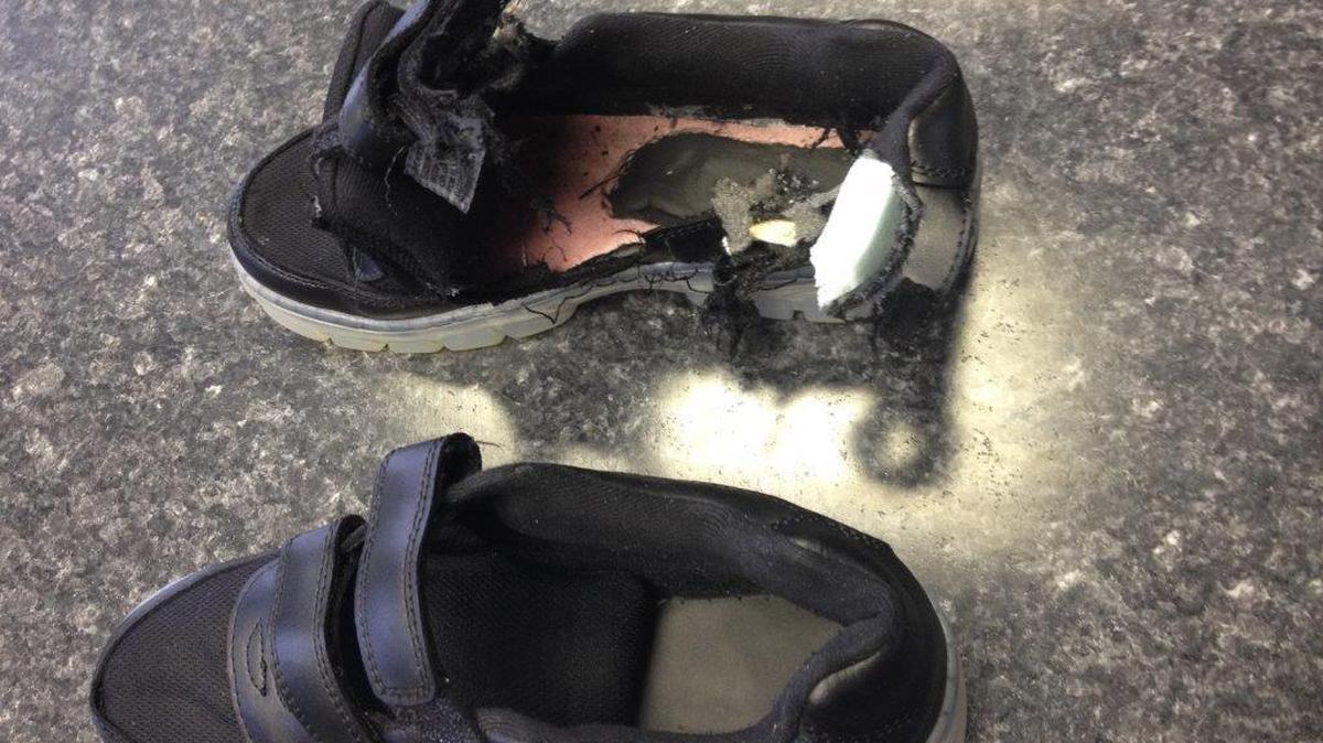 Keyon Felder’s right shoe bears witness to his near-deadly encounter with lightning on the roof of a building at Okeechobee Youth Development Center.