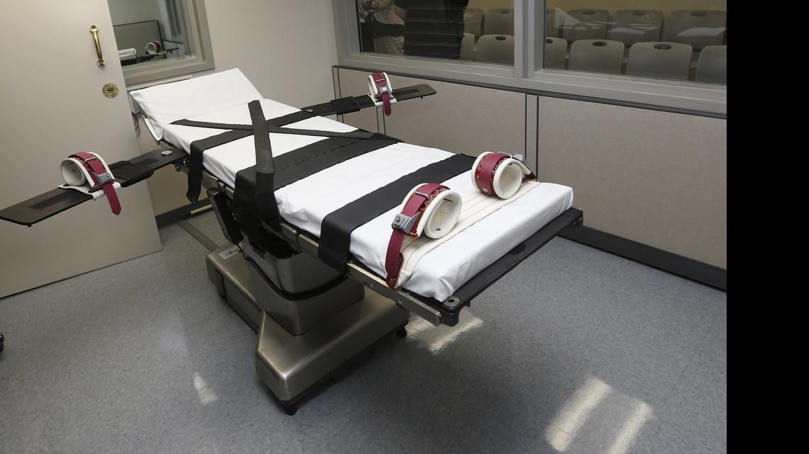 
FILE - This Oct. 9, 2014, file photo shows the gurney in the the execution chamber at the Oklahoma State Penitentiary in McAlester, Okla. On Monday, June 29, 2015, The Supreme Court voted 5-4 in a case from Oklahoma saying that the sedative midazolam can be used in executions without violating the Eighth Amendment prohibition on cruel and unusual punishment. Florida wants to start up executions again after a U.S. Supreme Court ruling Monday cleared a drug used in the state’s lethal injection cocktail. 

