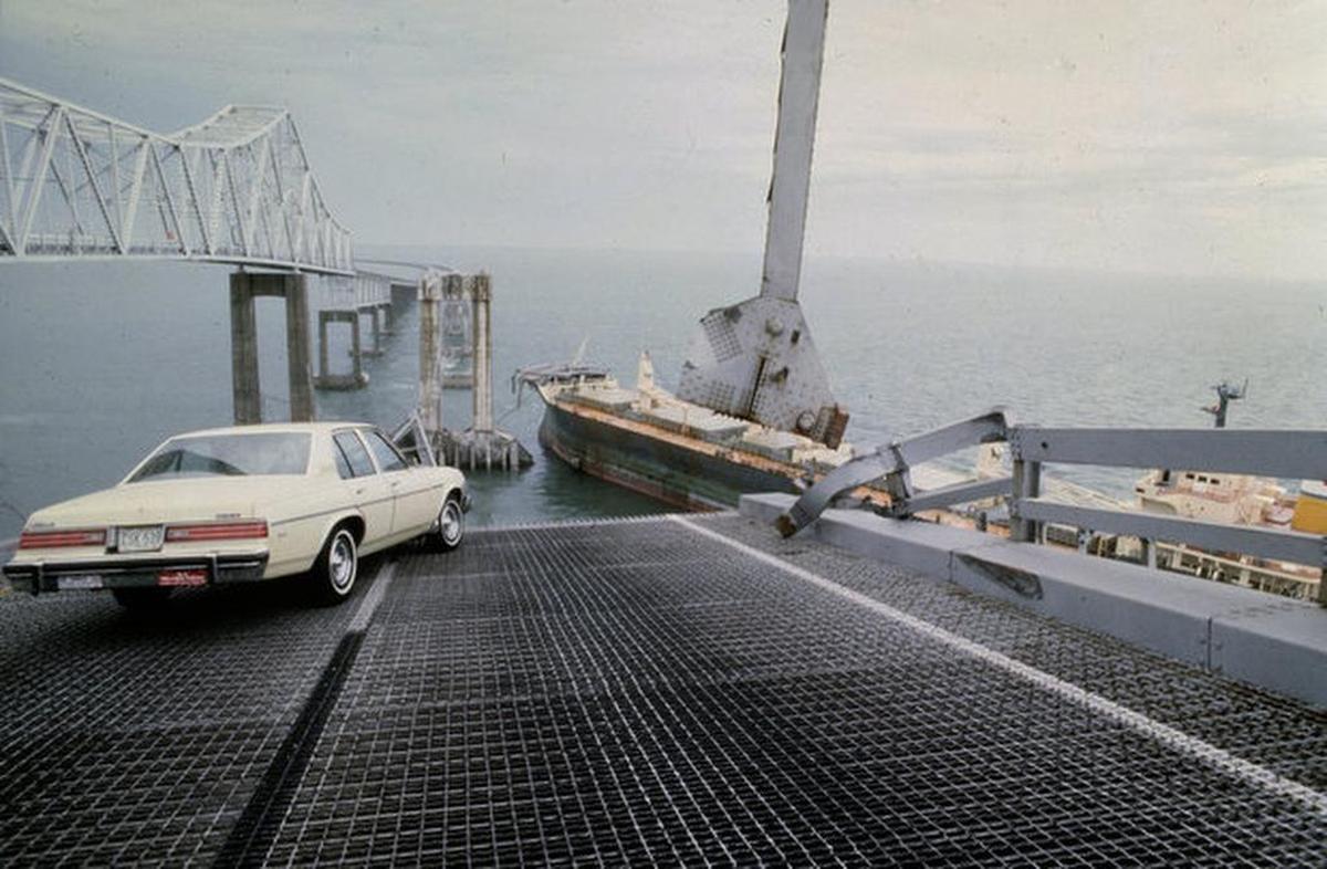 A car is halted at the edge of the Sunshine Skyway Bridge across Tampa Bay, Fla., after the freighter Summit Venture struck the bridge during a thunderstorm and tore away a large part of the span, May 1980. At least 31 persons were killed, 23 of them aboard a bus that toppled into the water.