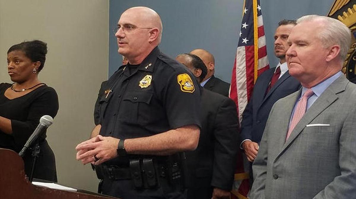Tampa police Chief Brian Dugan speaks at a news conference about the arrest of suspected serial killer Howell Donaldson, with sign language interpreter Derlyn Roberts on his left.