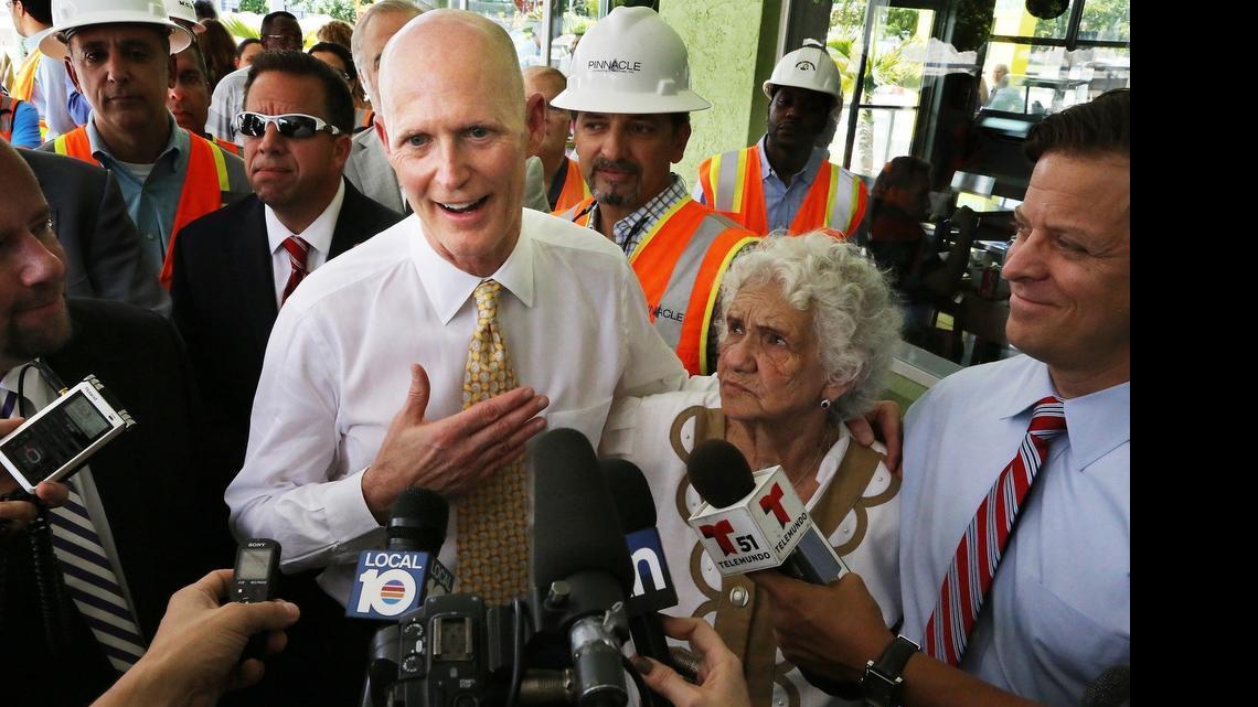 
FILE--Florida Gov. Rick Scott visits Hialeah March 9, 2015, to talk about a road construction project currently in progress.
