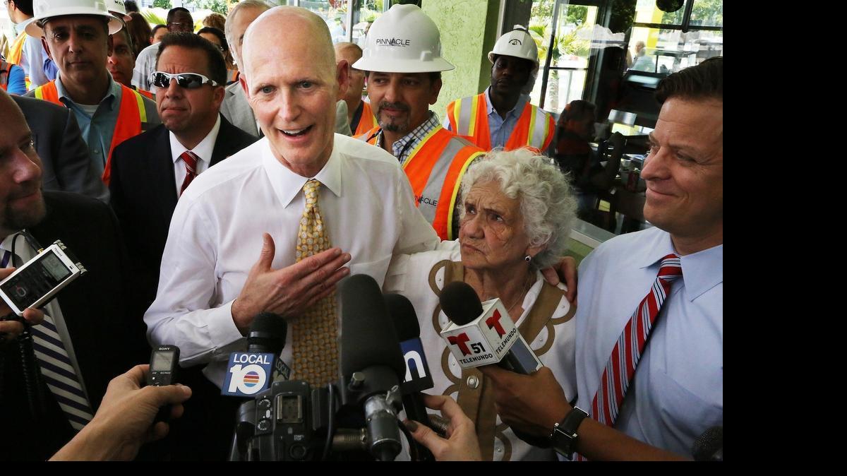 
FILE--Florida Gov. Rick Scott visits Hialeah March 9, 2015, to talk about a road construction project currently in progress.
