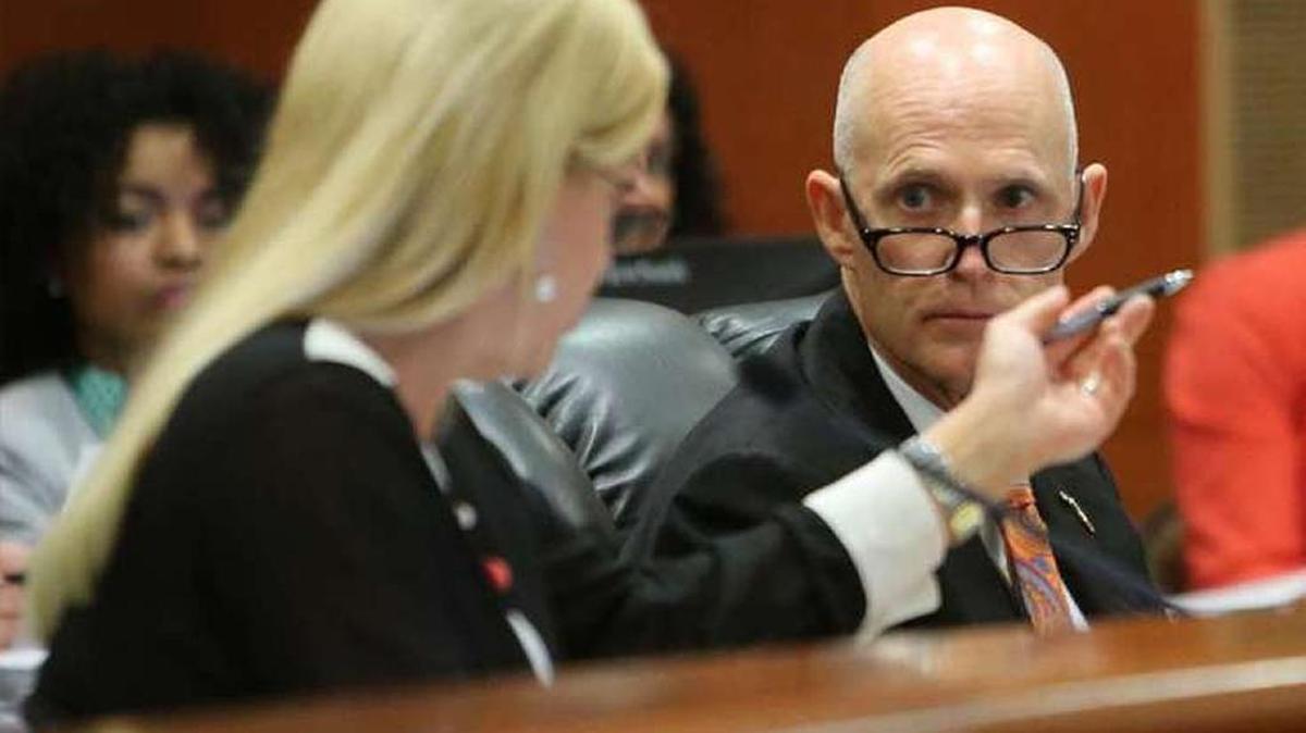 Florida Gov. Rick Scott and Attorney General Pam Bondi